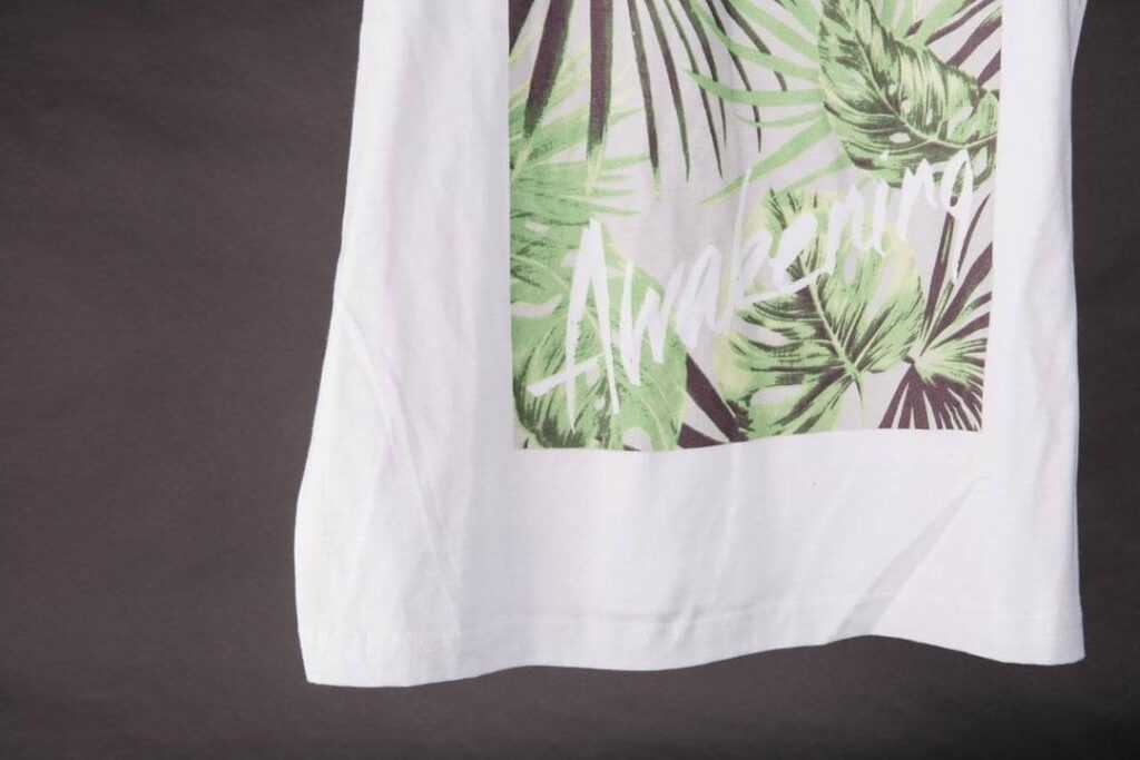 custom-t-shirts-ottawa-full-colour-printing-CMYK-white-t-shirt-hanging.jpg