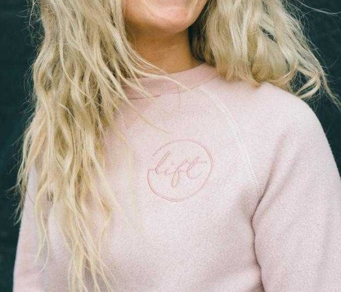 ottawa-embroidery-custom-sweatshirt-with-logo-woman-blonde-smiling